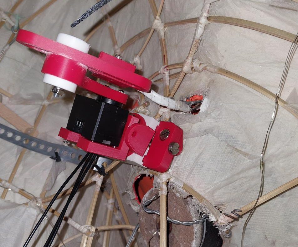 Interior of the lion head showing bamboo frame and mounted servo