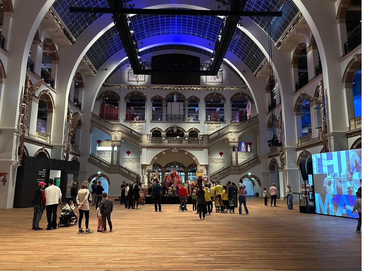 Wide view of the museum grand hall with visitors