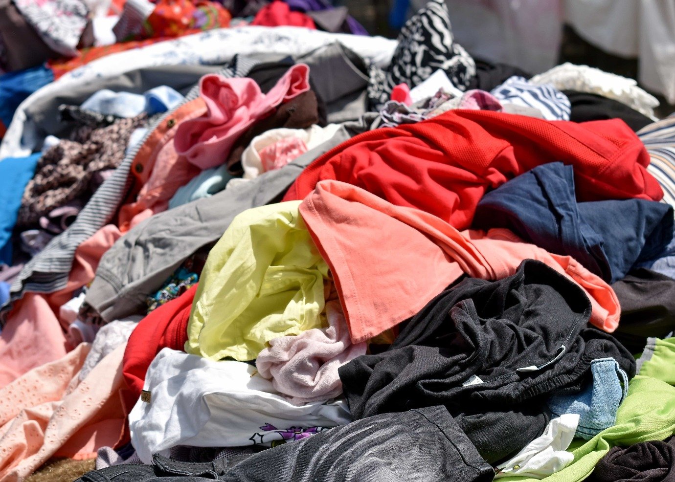 A heap of discarded clothing in many colours